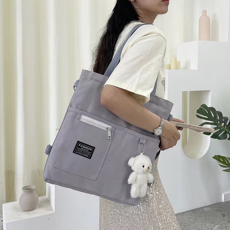 Bolso de lona de un solo hombro coreano para mujer multiusos ins Mochila de almacenamiento para estudiantes universitarios de moda