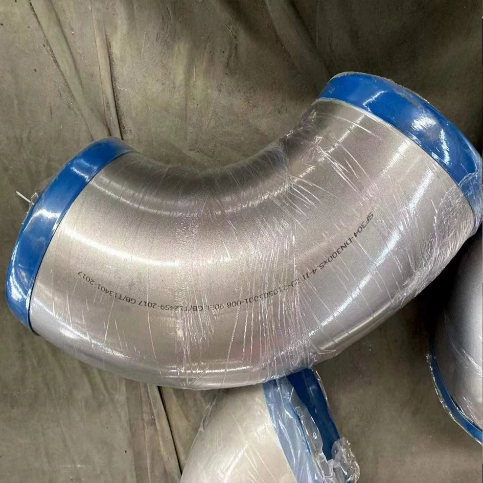 Производители поставляют коленчатые фитинги из легированной никелевой стали TA1TA2N4400, бесшовные сварные колена 325x12 мм.