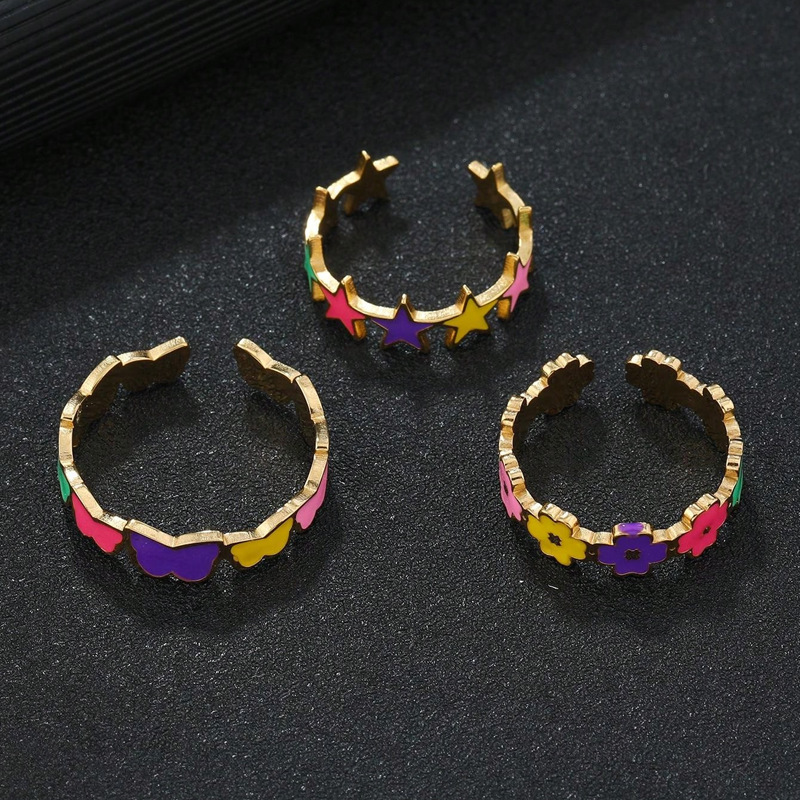 Joyas de acero inoxidable transfronterizas frescas gotas de aceite de color estrella de pentaco flores mariposa dopamina abierta anillo de acero de titanio