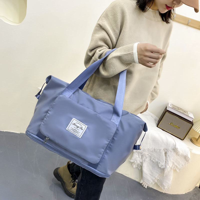 Bolsa de viaje plegable ligero gran capacidad buena bolsa de equipaje de almacenamiento bolso del estudiante puede cubrir trolley equipaje bolsa de moda