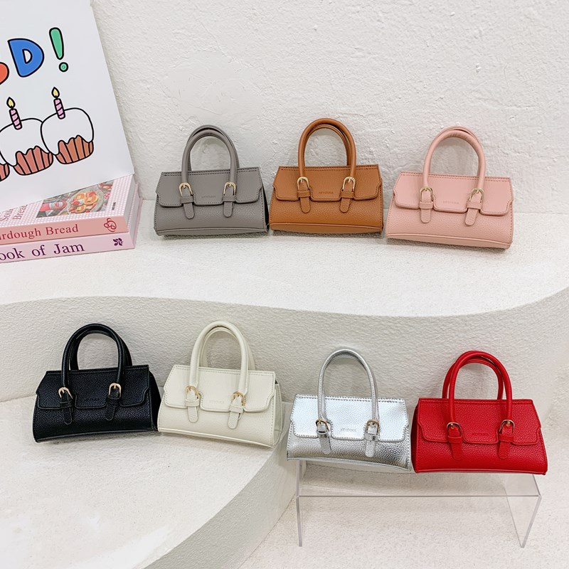 Bolso de hombro para niños y niñas de moda coreana, mini bolso de bebé de color sólido simple, nuevo bolso para niños de comercio exterior