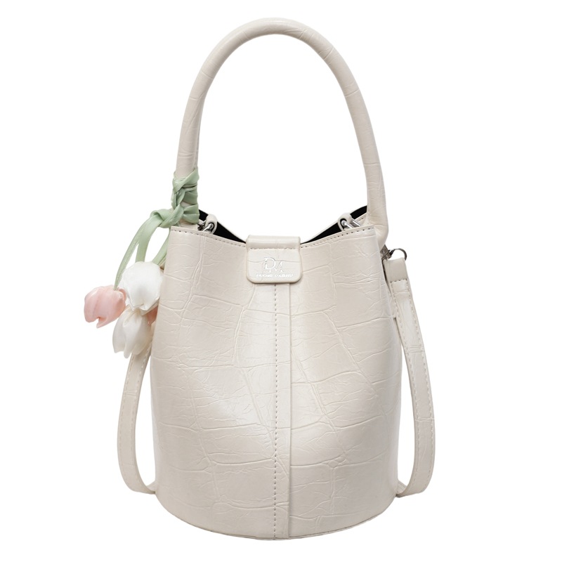 Bolso de cubo de jardín de verano 2025 nuevo bolso de mano estilo extranjero bolso de hombro con patrón de piedra pequeño bolso de mensajero fresco para mujer