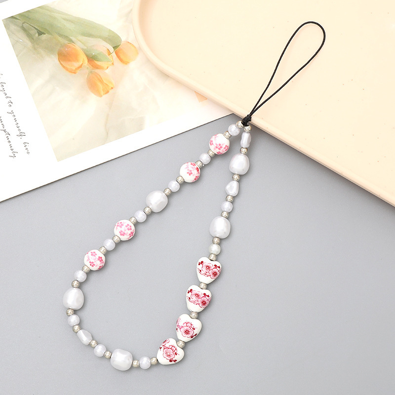 Venta caliente Internet celebridad con cuentas amor teléfono cadena anti-perdida gota resistente teléfono caso diy perla cadena corta teléfono cordón