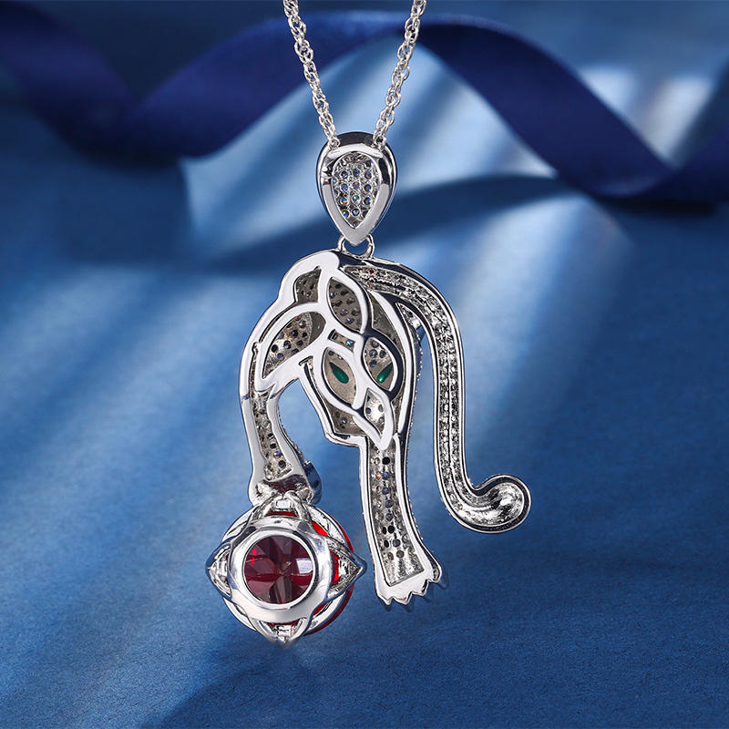 Otoño e invierno nuevo estilo zhuang sheng joyería europea y americana retro simulación rojo corindón leopardo de lujo con incrustaciones de piedra principal 16mm