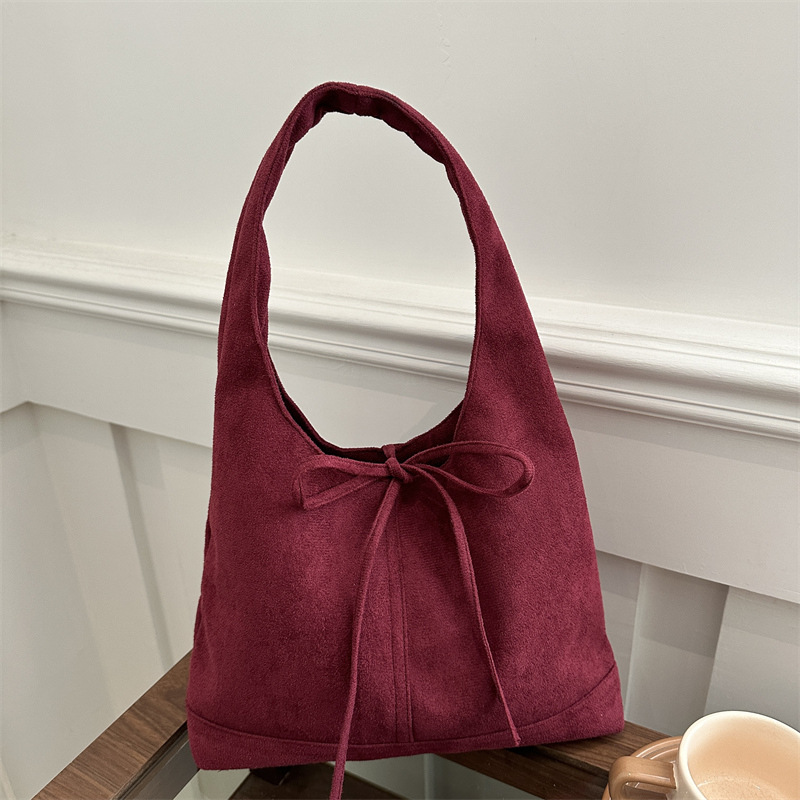 Lazos de nicho coreano estilo de moda ocio retro gamuza viaje de hombro único arco axilar bolsa de moda