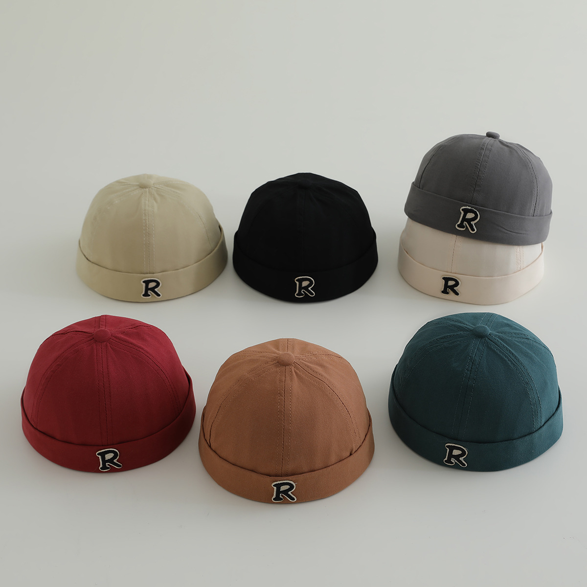 Primavera niños terratenientes sombreros hombres y mujeres letras de la marea sin bordes sombreros de piel de melón sombreros de calabaza sombreros de boina de personalidad