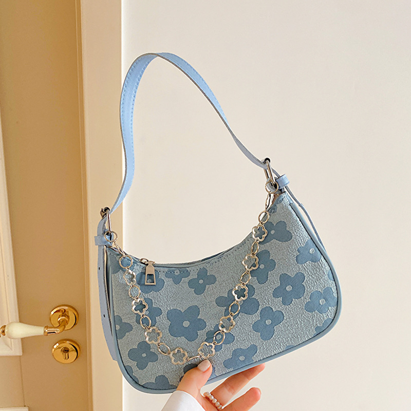 Bolso de las axilas para las mujeres 2023 nuevo bolso de mensajero de hombro de moda nicho retro ins baguette bolsa de tela tejida de encaje