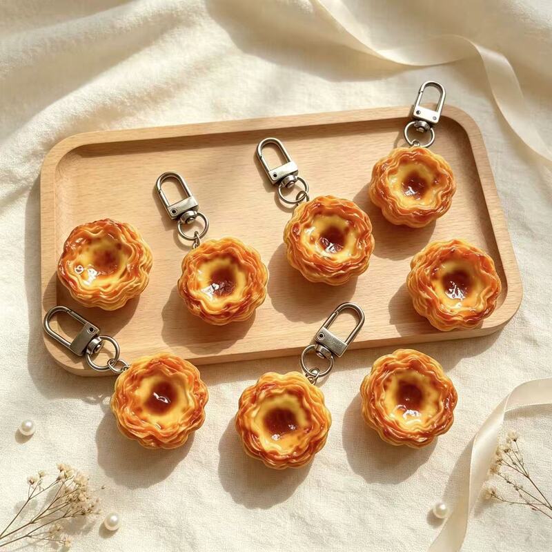 Super realistic egg tart keychain bag pendant accessory, hanging chain, zipper decoration, simulated food car pendant decoration Super realistic egg tart keychain bag pendant accessory, hanging chain, zipper decoration, simulated food car pendant decoration