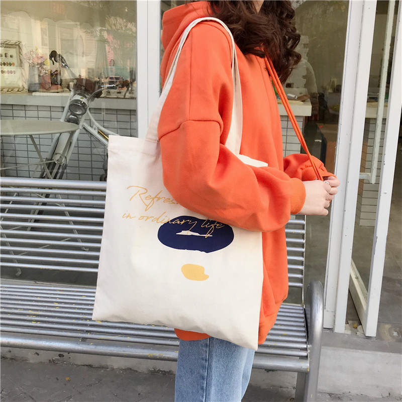 E131 canvas bag, Korean-style ins hand-held shoulder bag, color block letter graffiti shopping bag, female student's search for sources undefined