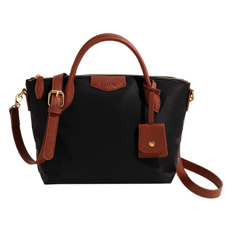 Transfronterizo nueva tela de nylon ligero Portátil Bolsa de mano de las mujeres 2024 primavera popular moda hombro bolsa de mensajero
