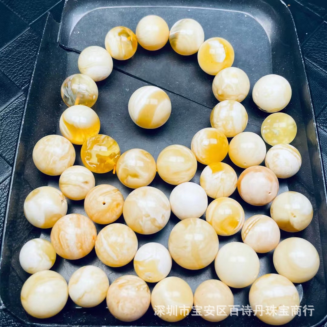 Wholesale amber beeswax round beads Russian white flower wax diameter 14-20mm tiger skin grain quality is very good supply place
