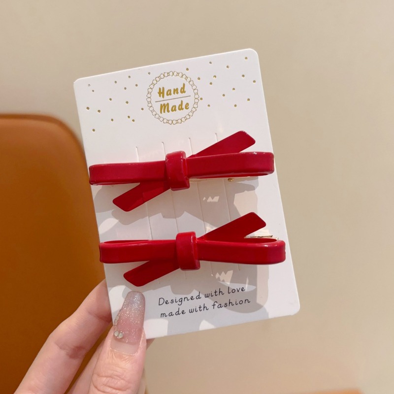 1 ¿ un par de horquillas de lazo cruzado de 7 cm