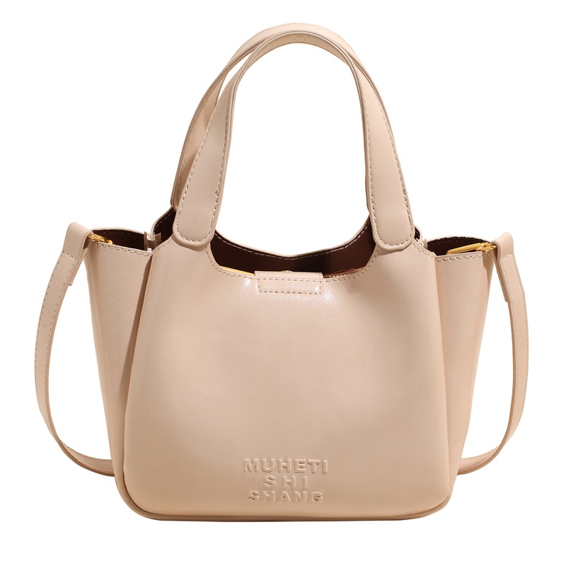 Vintage Maillard bolso de mano para mujeres 2025 nuevo estilo transfronterizo popular aceite cera cuero bolso de cubo textura mochila