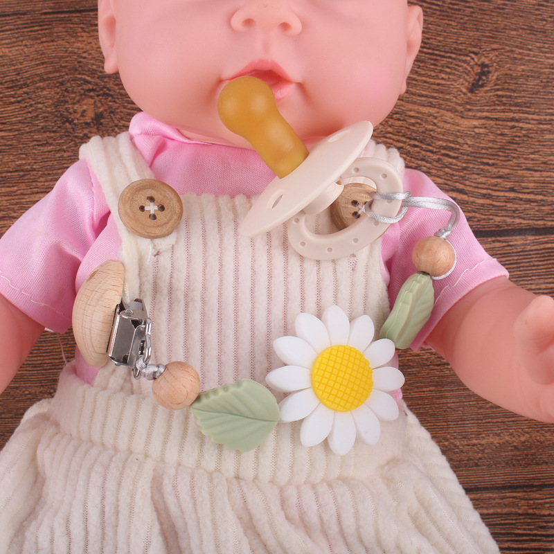 Nuevos suministros para bebés clip de chupete de haya calmante bebé girasol mordedura de silicona chupete cadena anti-caída de la cadena