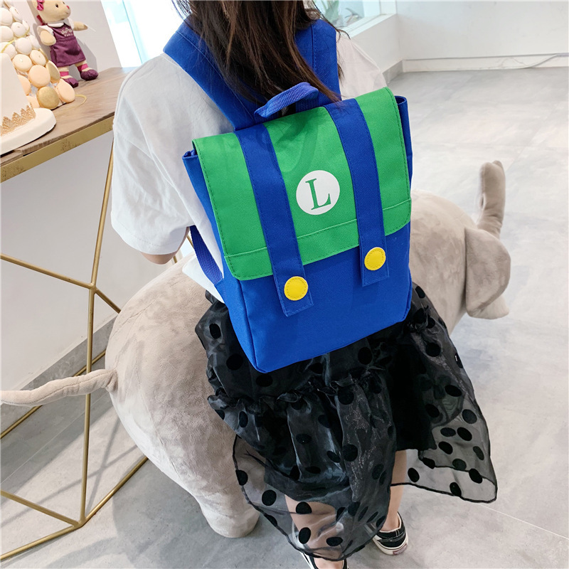 Nueva mochila infantil de estilo coreano con letras de dibujos animados impresas con LOGO, mochila para niños y niñas, mochila escolar de colores contrastantes para jardín de infantes