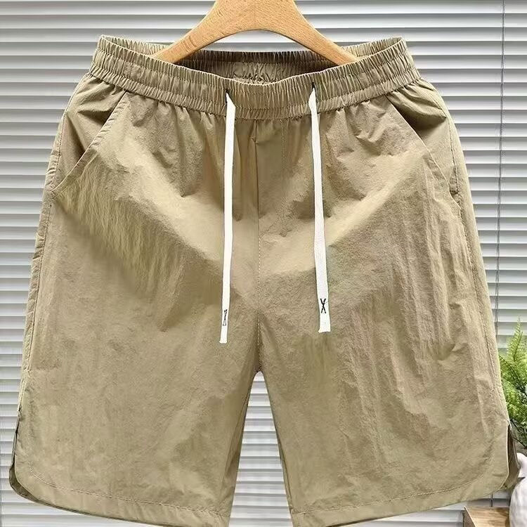 Nuevos pantalones de tendencia de cinco puntos para hombres comercio exterior transfronterizo de verano pantalones de playa para hombres pantalones cortos deportivos de cinco puntos para hombres pantalones de tendencia