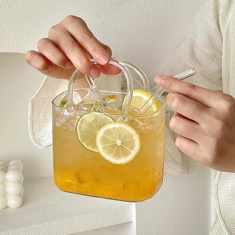 Bolso de vidrio en línea taza de té de frutas de verano transparente creativa extraña de alto valor de la cara taza de cóctel de jugo de fruta