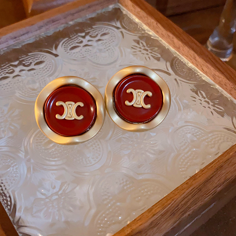 Pendientes de amor con goteo de aceite rojo con aguja de plata, botones de oreja de temperamento de moda de nicho, pendientes simples y de alta gama de estilo de Hong Kong