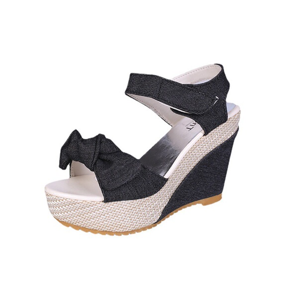 Summer fashionable cute sandals with a strap with bow wedge heel…