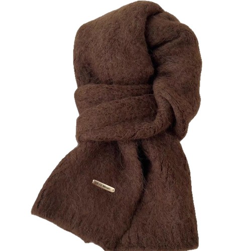 A versatile knitted scarf for women, perfect for winter with an atmospheric, solid-color, minimalist, soft, warm, and lazy-style design.