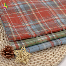 现货涤棉色织磨毛格子衬衫服装面料 新款时装男女后工艺布 格子布