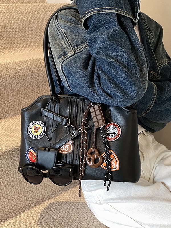 Insignia retro de gran capacidad hombro brazo bolso para mujeres 2025 nueva moda transfronteriza alta textura bolso
