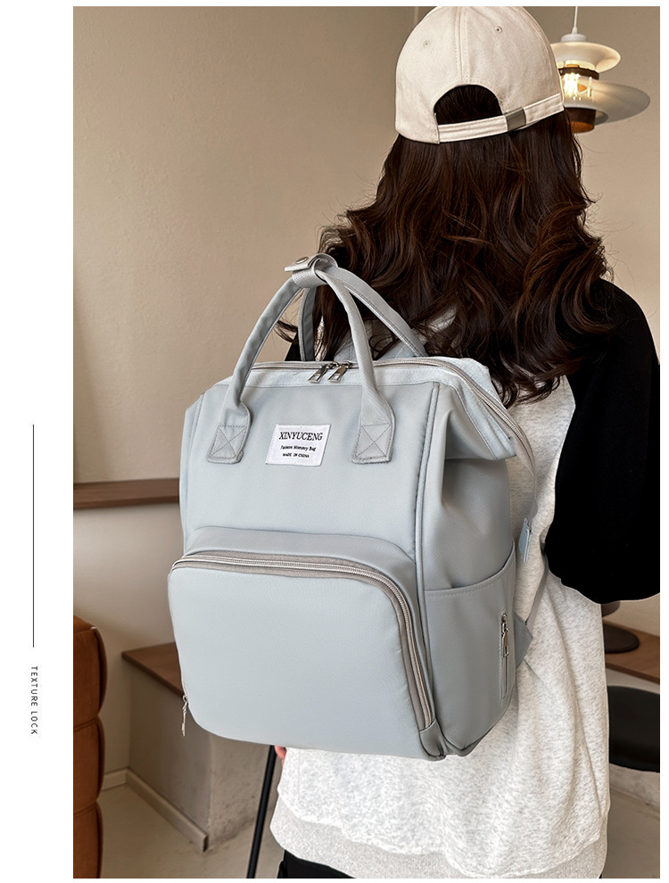 Solid-color lightweight mom bag, a backpack for taking kids out, multi-functional large-capacity mother and baby bag for girls undefined
