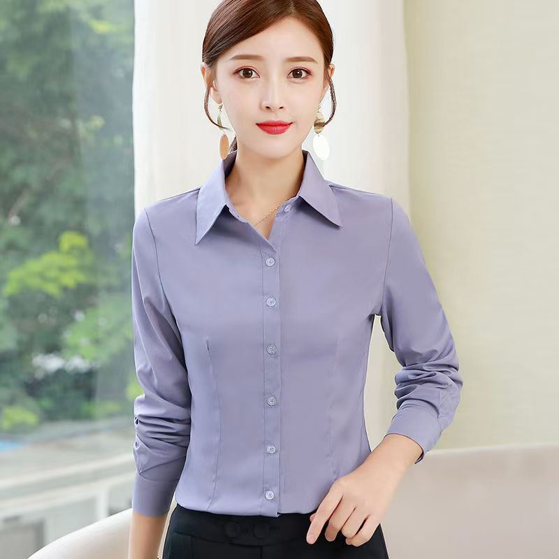 新しいチベットの青いシャツの女性の長袖の修身の職業の服装の大きいサイズの工装の作業服の韓国版のファッションはシャツを打ちます。