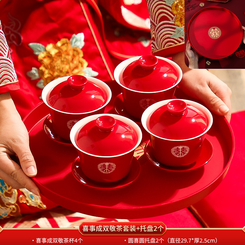 Matrimonio con un juego de tazas de té, un par de cubiertas de tazón rojo, artículos de té, artículos de boda, artículos de boda.