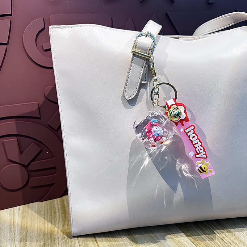 Creativo en la olla de arroz de aceite de la luna de orejas perros llaveros lindos dibujos animados pareja colgante garra máquina pequeños regalos al por mayor