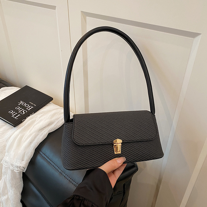 Bolsos de diseño de nicho de ocio para mujer 2025 nuevo bolso de axila de un solo hombro de moda de primavera bolso de palo de mano de moda