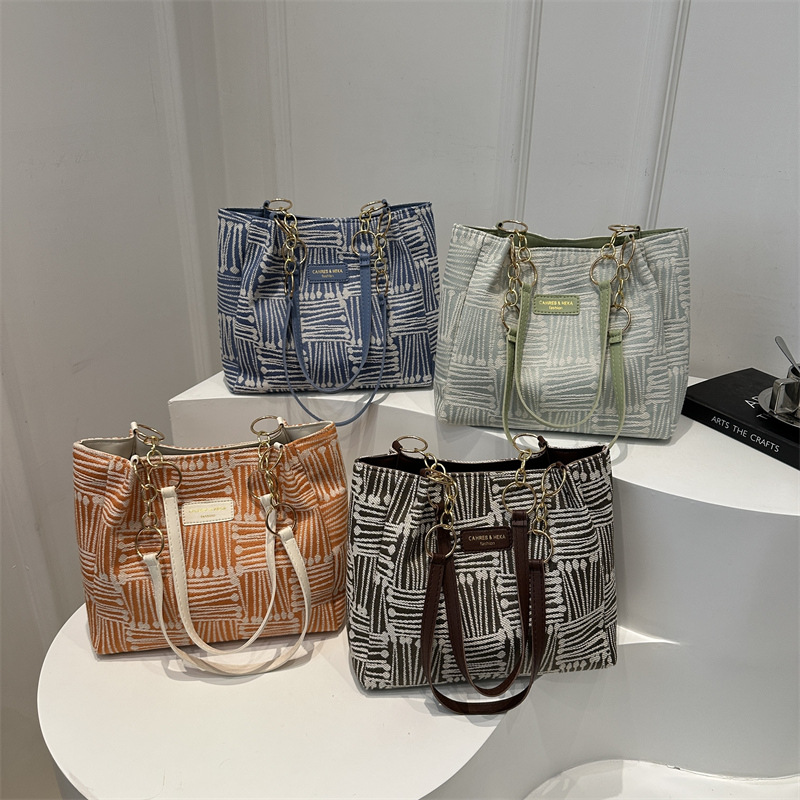 Bolso Tote simple y de gran capacidad para mujer 2024 nuevo bolso de hombro a rayas de moda coreana bolso de axila de arte relajado