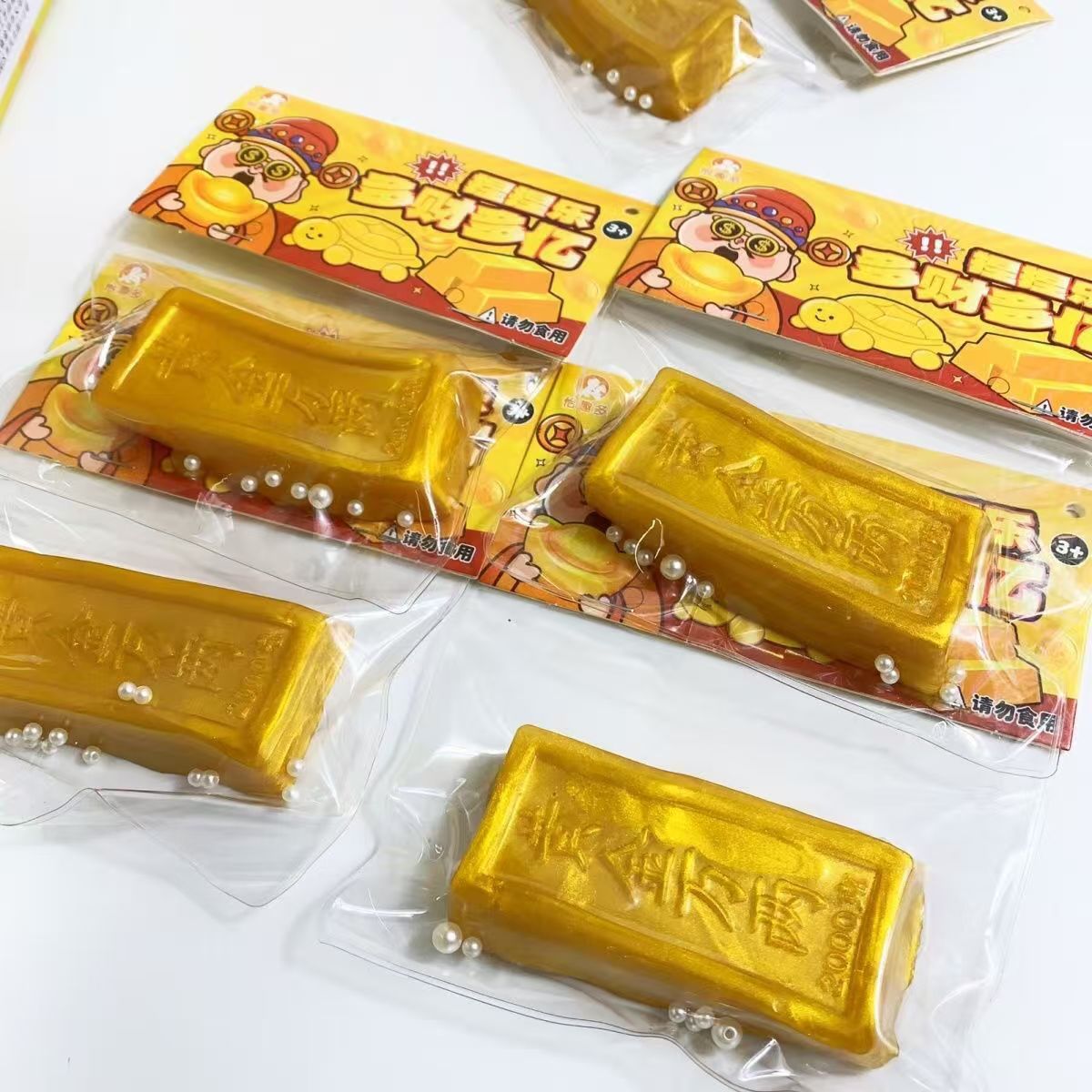 El nuevo juguete de descompresión de barra de oro amasó creativamente el juguete de descompresión de niños amasó la descompresión para desahogar la caja completa de juguetes de rebote lento al por mayor.