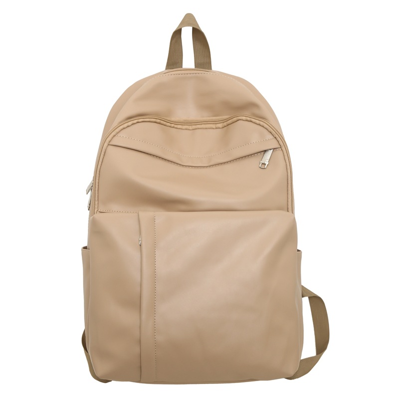 2023 nueva mochila de cuero suave de pareja de gran capacidad casual simple y versátil mochila escolar de computadora de viaje al aire libre al por mayor