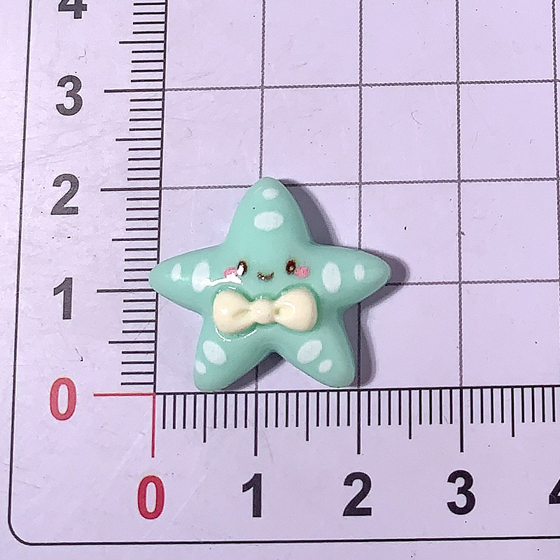 Cartoon brillante corbata estrella de mar material DIY accesorios de resina pegamento crema caja de teléfono móvil material clip de pelo parche de taza de agua