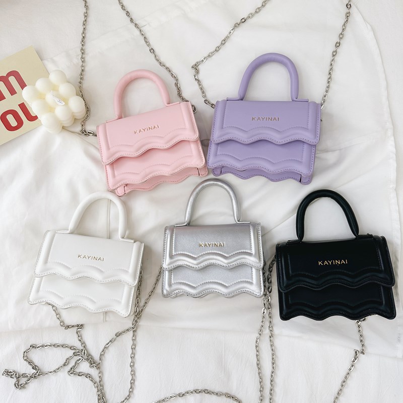 Bolso bandolera de niña coreana moda color sólido estilo occidental mini bandolera para niños verano nuevo alfabeto bolso para niños