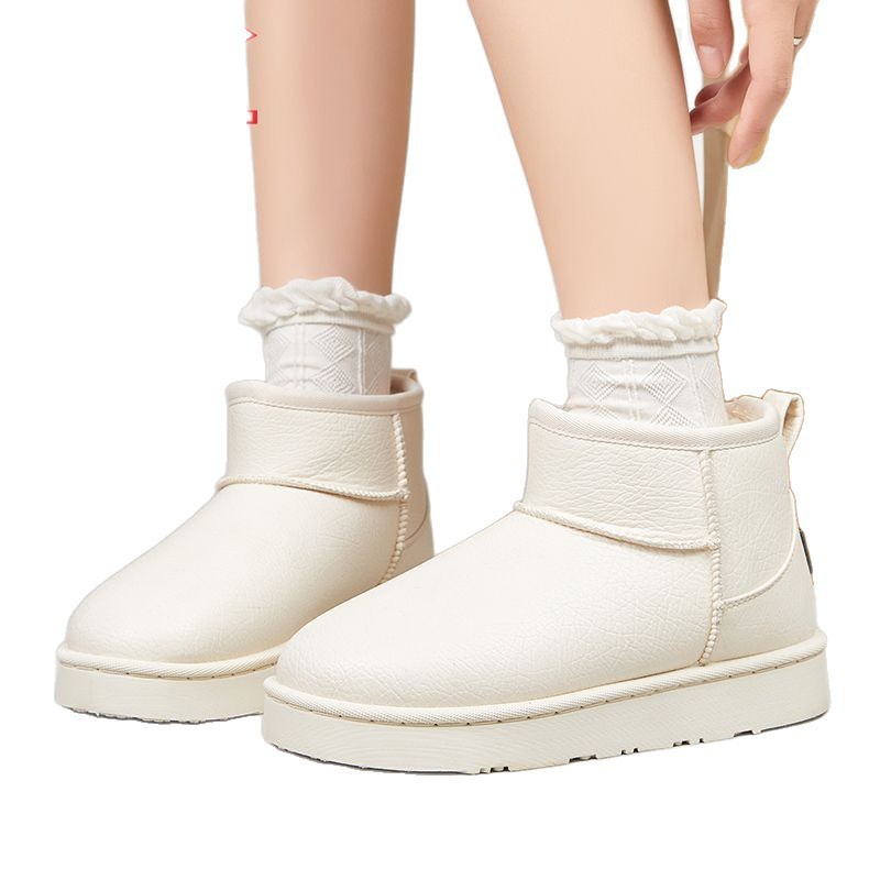 Backforce botas de nieve de lana de color sólido en invierno para hombres y mujeres, zapatos de algodón caliente para viajes simples y de alto valor.