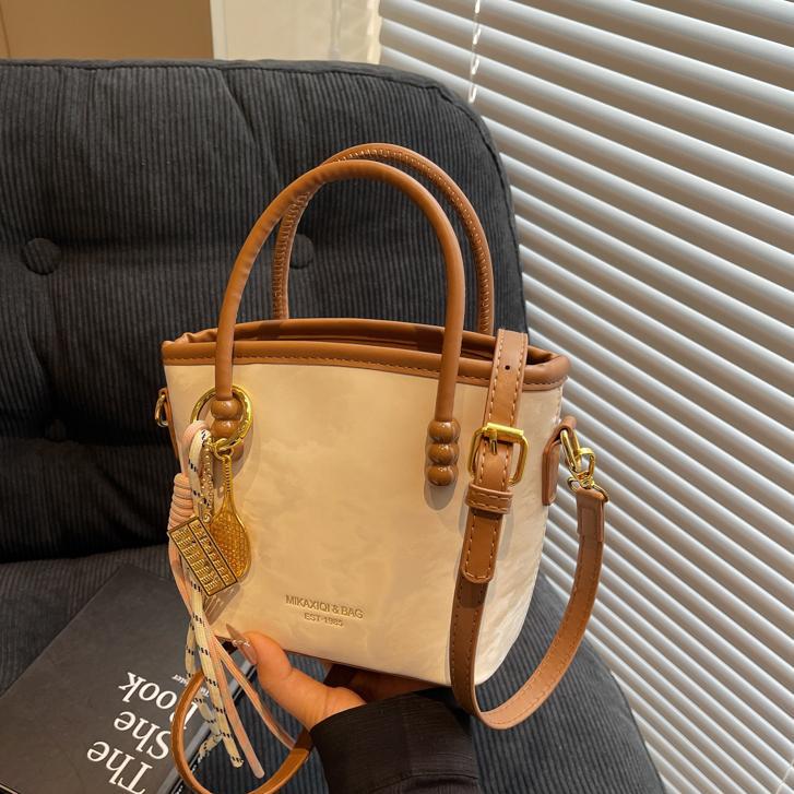 Comercio exterior venta caliente bolso de cubo de mano damas 2025 nuevo estilo de tendencia universal bolso de hombro de alta calidad bolso de moda