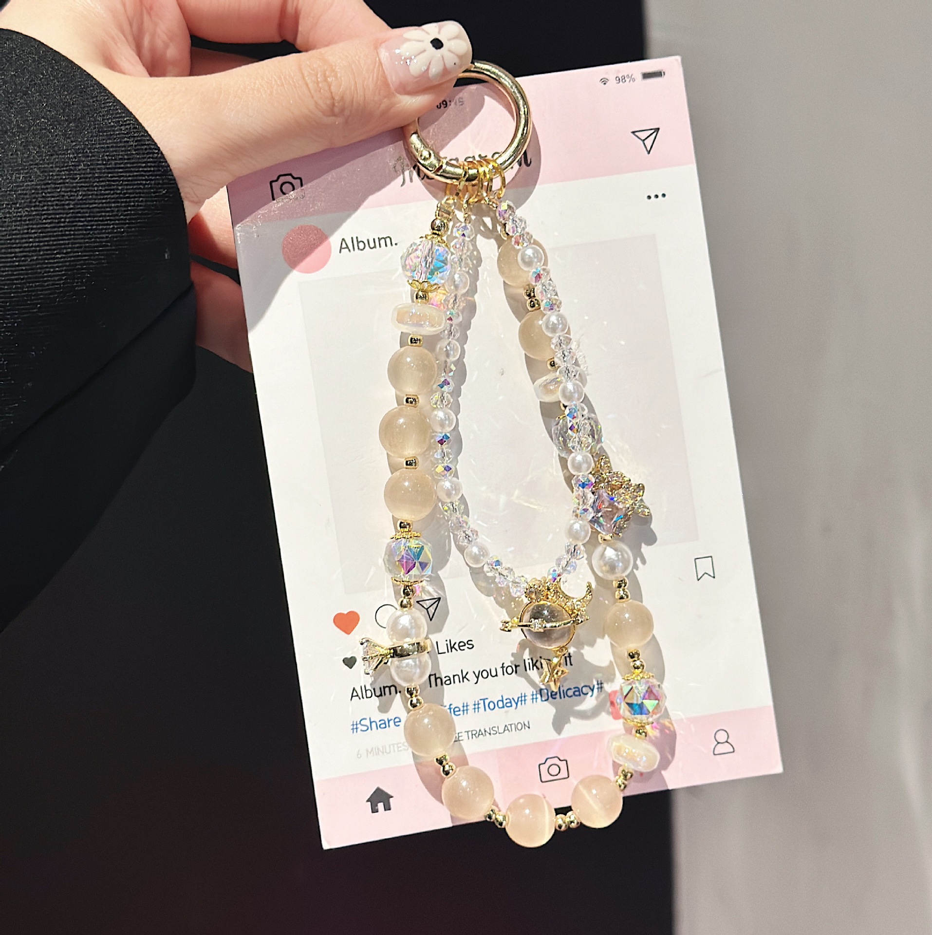 Boutique hecho a mano de alta gama para teléfono móvil cadena larga de vidrio de universo pequeño femenino cordón de teléfono móvil de moda colgante de mensajero largo