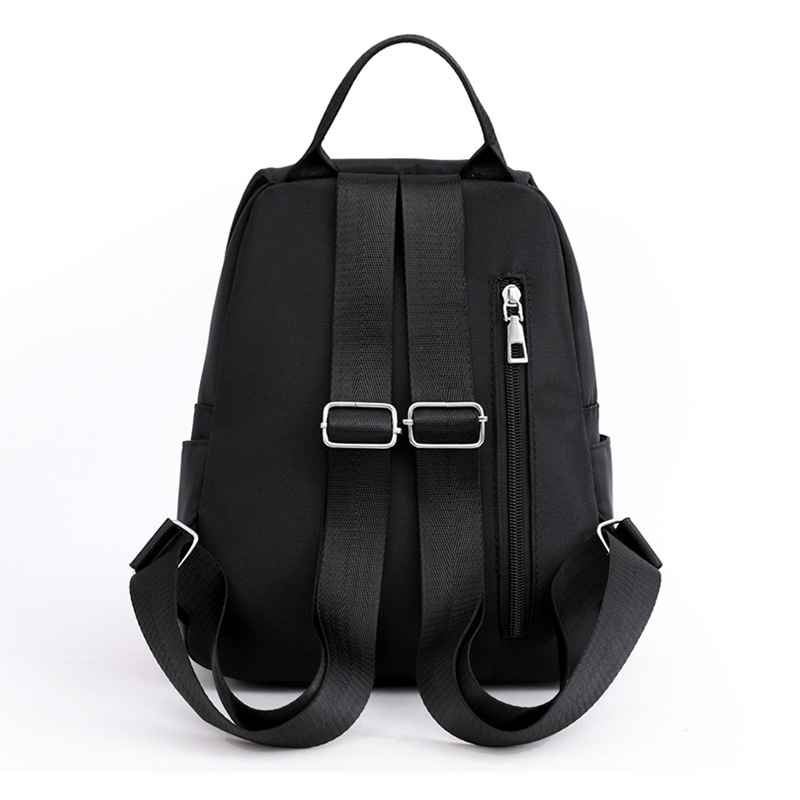 Comercio exterior al por mayor 2022 nuevas señoras casuales mochila de tela Oxford color sólido salvaje mochila de viaje urbano