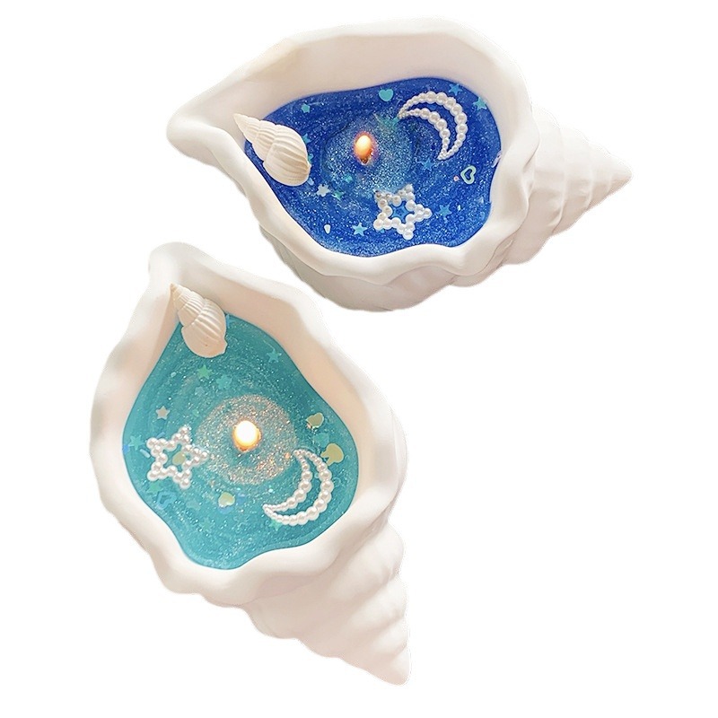 Doftljus formad som snäcka i presentförpackning för stämning_voghion.com