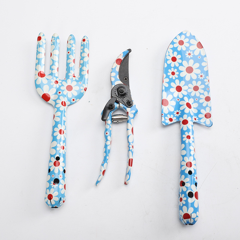 Herramientas al aire libre textura de impresión de flores pequeñas herramientas de jardín conjunto de tres piezas de impresión pala jardín flores y plantas herramientas de jardinería