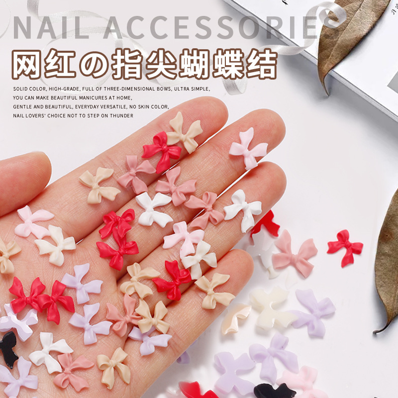 Joyas de arco de uñas al por mayor en línea explosión simple de resina joyas de uñas estereoscópicas flotantes mezcladas 50