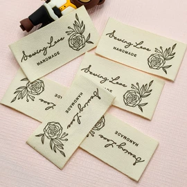 洗唛、商标;吊粒、吊牌;布贴