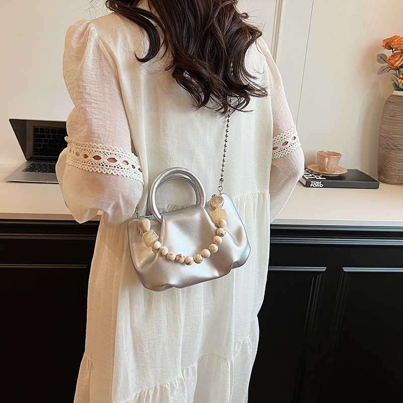 High end handbag for women in 2024, new niche design, summer handheld pleated chain strap, crossbody cloud bag_voghion.com