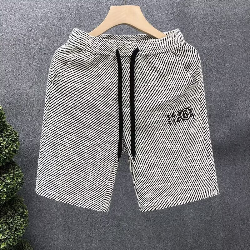 Verano delgado estilo americano retro sensación de diseño simple pantalones cortos a rayas nicho de hombre grande pantalones casuales sueltos