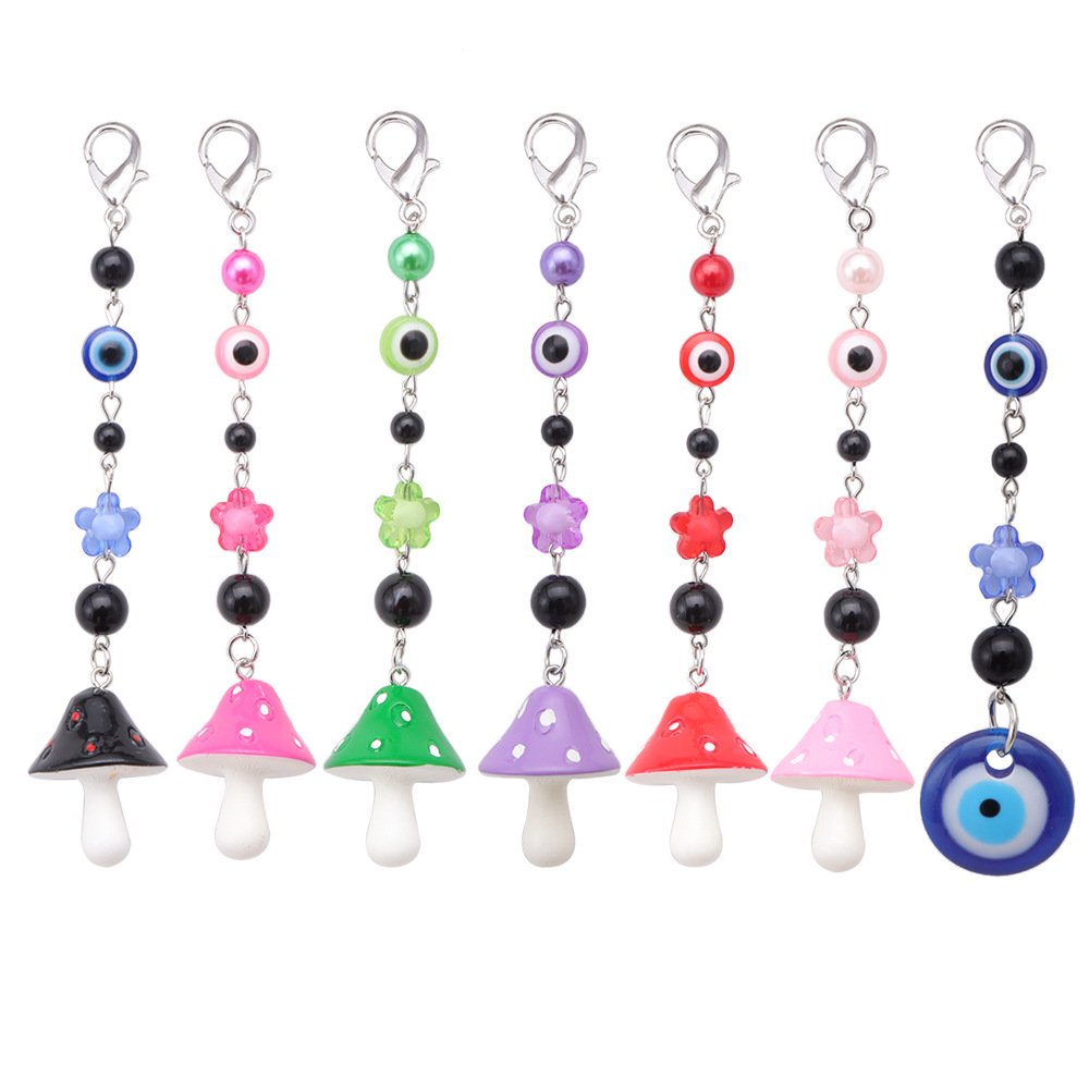 La versión coreana transfronteriza de la joyería de llavero de setas de color, la resina de dibujos animados, el ojo creativo del diablo, el bolso, el colgante de accesorios