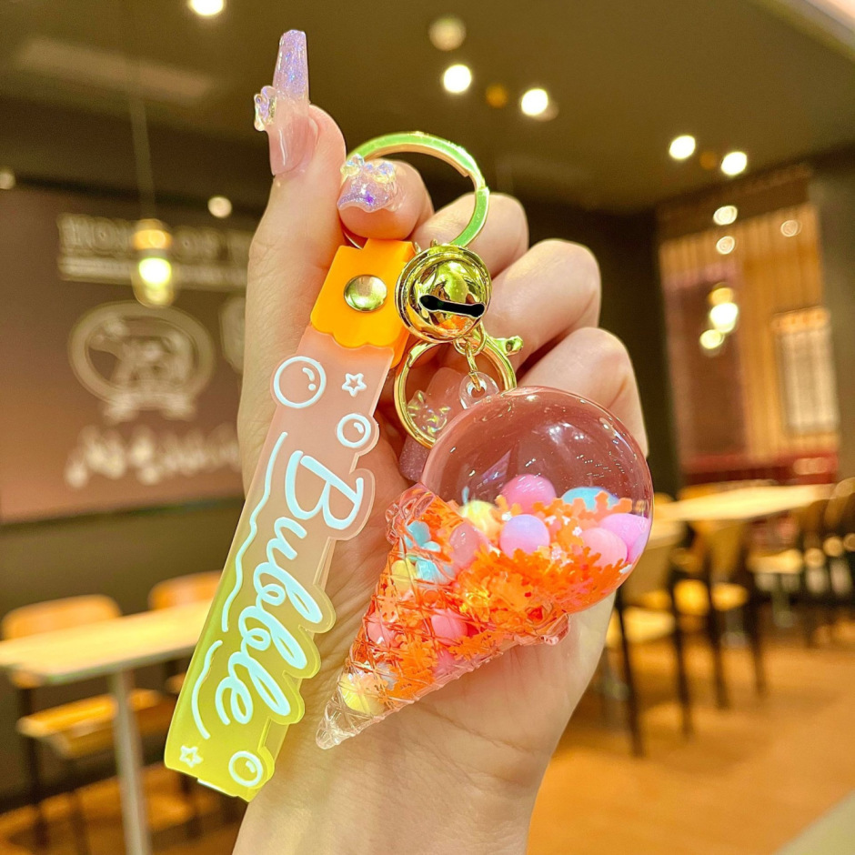 Arenas flotantes transfronterizas coloridas frijoles botellas flotantes de helado llaveras de chicas bolsos colgantes de arena flotante pequeña decoración colgante para mujeres