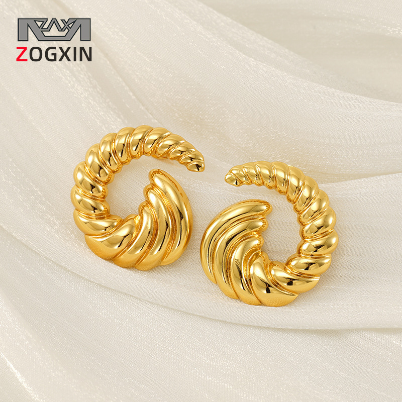 Estilo INS transfronterizo europeo y americano, personalidad simple, sentido de diseño de tendencia, oro de 18k, pendientes de acero de titanio en espiral que no se desvanece, pendientes de mujer