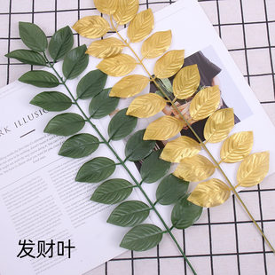 Simulated green plant leaves, artificial plant wall flower arrangements and materials, fake leaves, photography, simulated flower arrangements, shooting props
